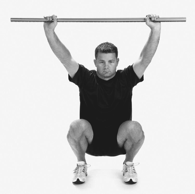 Sports Physio in Newcastle Performing Hurdle Deep overhead squat